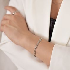 "This bracelet features a figaro chain that measure 5 mm wide and can be made to fit your wrist snugly. Be sure to measure your wrist if you are going for a tight fit like the model who is wearing the 5.75 inches. Otherwise, the standard length at department stores for women's bracelets is 7 inches. Made of surgical steel, which features a deep, true silver color, this piece of jewelry is hypoallergenic, water-resistant, and tarnish-resistant. --------------------♥ PROMOS ♥-------------------- W Elegant Silver Cuban Link Bracelet With Adjustable Chain, Silver Minimalist Cuban Link Bracelet With Adjustable Chain, Silver Cuban Link Bracelet With Adjustable Chain, Minimalist Silver Bracelet With Figaro Chain, Elegant Silver Figaro Chain Bracelet, Minimalist Silver Figaro Chain Bracelet, Trendy Silver Curb Chain Bracelet, White Gold Bracelets With Figaro Chain For Gift, Silver Figaro Chain Bracelet As Gift