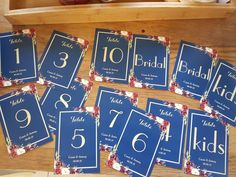 the table numbers are laid out on top of each other to be used as place cards