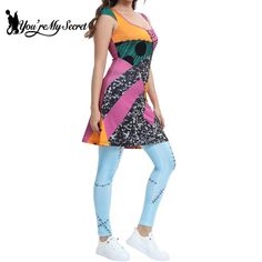 a young woman is standing in front of a white background wearing a colorful dress and leggings