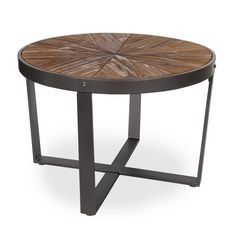 a wooden table with metal legs and a circular design on the top, against a white background