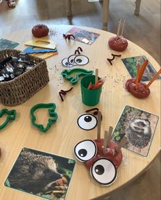 the table is covered with pictures and magnets for kids to make their own animals