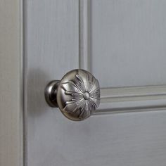 a close up of a door handle on a white door