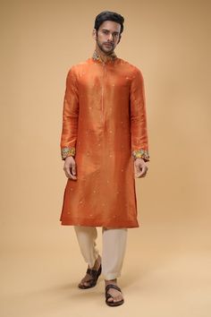 Orange kurta with all over floral threadwork motifs, embellished by beads and sequins. Comes with pant. - Aza Fashions Embroidered Orange, Men Kurta, Kurta With Pants, Mandarin Collar, Aza Fashion, Mens Pants, Sequin, Collar, Beads