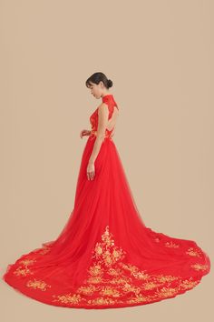 You can have all the red and gold your heart desires with this romantic, dreamy A-line dress (and please the parents too). Made with soft breathable lace and tulle fabric adorned with elegant gold floral embroidery and finished with a dramatic cathedral length train, this red and gold wedding cheongsam will make you feel like being princess-carried all night long. Check out our Yuan Jacket for a matching groom's jacket made with a red and gold dragon brocade fabric. Check out additional dresses Qipao Wedding Dress, Cheongsam Wedding Dress, Red And Gold Wedding, Wedding Dress Traditional, Red Cheongsam, Cheongsam Wedding, Wedding Cheongsam, Qipao Wedding, Red Lace Top