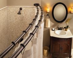 a bathroom with a sink, mirror and towel rack in it's corner next to a toilet