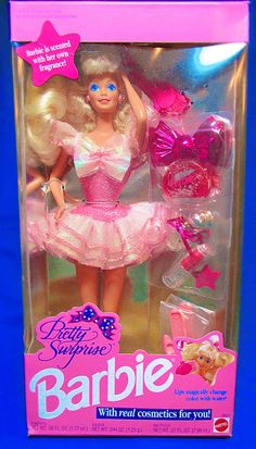 the barbie doll is wearing a pink dress