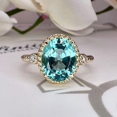 Wow picks! Oval Paraiba Tourmaline And Diamonds Three Stone Ring 14K Yellow Gold Paraiba Twist Band Ring Unique Vintage Paraiba Tourmaline Ring #6154 at $574.00 Choose your wows. 🐕 #DiamondRing #OvalCut #14kYellowGold #ThreeStoneRing #VintageParaiba #TwistBandRing #UniqueRing #ParaibaRing #ParaibaTourmaline #TourmalineRing Oval Tourmaline Ring For May Birthstone, Oval Tourmaline Emerald Ring For Anniversary, Oval Emerald Ring With Tourmaline For Anniversary, Tourmaline Jewelry With Halo Setting For Anniversary, Tourmaline Emerald Ring With Center Stone As Gift, Oval Tourmaline Ring With Center Stone, Oval Tourmaline Birthstone Ring, Anniversary Rings With Tourmaline Gemstone Accents, Tourmaline Ring With Center Stone For May Birthstone