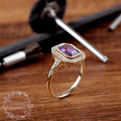 "(Please confirm your US size when you make an order) Jewelry Details -Gold Type : 14k gold Center Stone: NATURAL Amethyst 5.5*8mm, Approximately 1.5ct Color: 3A Clarity: VS Cut: Emerald Cut / 3EX Side Stone: 0.14cttw diamond Color: G-H Clarity: SI1 Cut: Round Cut / 3EX Band Width: Approximately 1.8mm SKU: YR0142 ~*-*~Purchase Guarantee: - All our jewelry is handmade, and each process is refined. - 14 Day Refund Guarantee. - All our products are Free Shipping. - Free Gift Box&Packing. ~*-*~P Art Deco Purple Amethyst Ring For Anniversary, Purple Amethyst Art Deco Ring For Anniversary, 14k Gold Art Deco Amethyst Ring, 14k Gold Amethyst Ring In Art Deco Style, 14k Gold Amethyst Ring Art Deco Style, Heirloom Purple Sapphire Ring For Anniversary, 14k Yellow Gold Amethyst Ring With Halo Setting, Heirloom Style Purple Amethyst Ring With Bezel Setting, Heirloom Purple Amethyst Ring With Bezel Setting