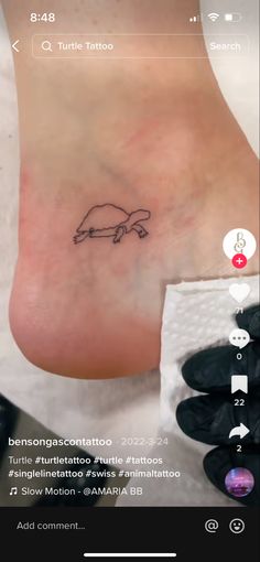 a foot with a small tattoo on it