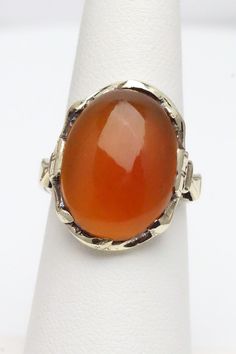 Antique Carnelian Cabochon Ring 14K Yellow Gold Size US 6.25 Weight: 5.9 grams Gemstone measures approx 19.5mm x 14.5mm Head of Ring measures approx  22.2mm tall  This is a pre-owned item in Good Condition. It does show signs of use/wear but there is still lots of life left to this ring.  The last photo is what the cabochon looks like when I hold it up to light.  C8649 Ring Cat, Cabochon Ring, Rings Statement, Matching Earrings, Statement Rings, Jewelry Rings, Etsy Gift Card, Yellow Gold, Gemstones