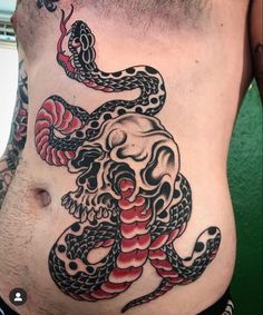 a man's stomach with an octopus and snake tattoo on the side, in black and red