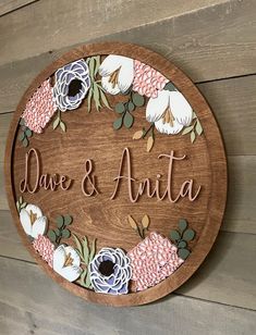 a wooden sign with flowers on it that says,'save and amata '