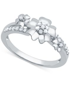 a white gold ring with flowers and diamonds