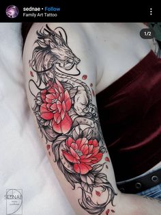 a woman's arm with flowers and a dragon tattoo on the left side of her body