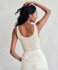 Rib Tank Cream Delicate straps and a classic rib, the Rib Tank is a must for any uniform of elevated basics. Perfect for layering under any knit or oversized button-down. 100% organic cotton. Made in USA. Ribbed scoop neck tank with thin straps. Jenni Kayne, Elevated Basics, Ribbed Tank Tops, Warm Weather, Backless Dress, Camisole Top, Made In Usa, Scoop Neck, Layering