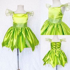 the dress is green and has bows on it