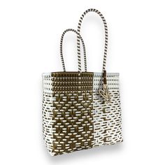 Indulge in luxury with our Duo tote, featuring the timeless Maria Victoria Bag in a captivating handwoven design. Made from repurposed plastic, this versatile bag is perfect for poolside lounging, beach outings, grocery excursions, and everyday tasks. With easy cleaning and fade-resistant colors, you'll never want to leave without it. Measurements: length x depth x height with handle length Extra Large(OT): 17.5x8x18.5 inches with 8 inch handles Large(OR): 15.5x7.5x15 with 8 inch handles Medium( Maria Victoria, Medium Tote, Easy Cleaning, Extra Large, Hand Weaving, Handles, White Gold, Tote Bag, 10 Things