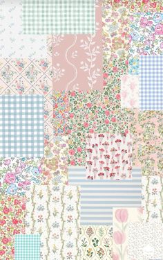 a patchwork quilt with many different colors and patterns on it, including pink, blue,