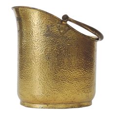 a gold colored metal container with a handle