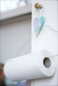 a roll of toilet paper is hanging on the wall