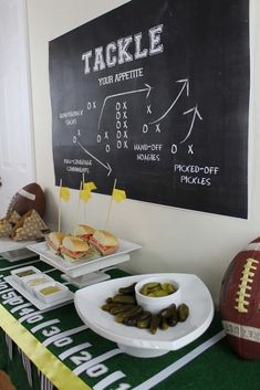 a football themed party with snacks and snacks on the sidelines, including pickles