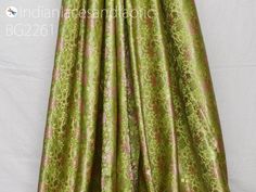 Apple Green Indian Jacquard Dress Material Brocade Wedding Dress Fabric By The Yard Crafting Sewing Silk Curtains Making Duvet Cover Bridal Dresses. Tanchoi Banarsi Brocade Fabric. This is a beautiful jacquard floral design fabric in Apple Green color. ➤ Fabric Type: Blended Silk (Viscose & Silk Satin) ➤ Color: Apple Green, Pink, Lime Green and Golden. ➤ Code: bg2261 ➤ Width of the fabric is 44 inches. ➤ Listing for 1 Yard of fabric. ➤ Care: Dry Clean Only You can use this fabric to make Dre Formal Fitted Brocade Fabric, Fitted Formal Brocade Fabric, Fitted Green Fabric For Festive Occasion, Green Brocade Dress For Wedding, Green Brocade Wedding Dress, Green Traditional Drape Fabric For Wedding, Green Wedding Fabric For Traditional Drape, Green Wedding Fabric With Traditional Drape, Green Wedding Fabric In Traditional Drape