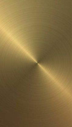 an abstract gold metal background with some thin lines in the center and one light at the end