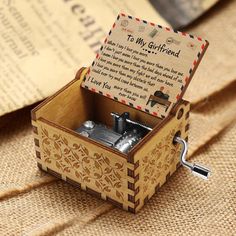 a wooden music box with a poem in it