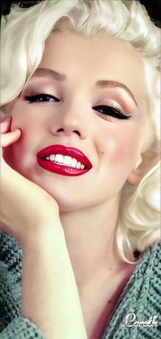 a woman with blonde hair and red lipstick