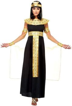 an egyptian woman in a black and gold dress with her hands out to the side