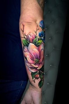 a person with a flower tattoo on their arm