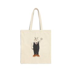 a tote bag with an image of a white bear wearing a suit and tie