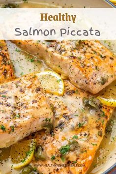 healthy salmon piccata with lemons and herbs in a skillet