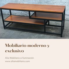 an advertisement for a coffee table made out of metal and wood with the words mobiliario moderno y exclusivo