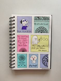 a spiral notebook with some drawings on it