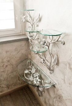 a glass shelf sitting next to a window