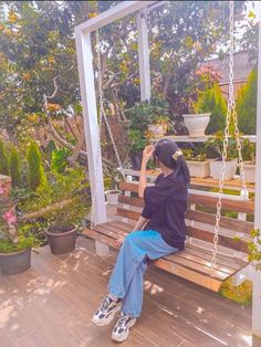 a woman sitting on a porch swing