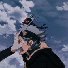 an anime character holding his head in front of the sky