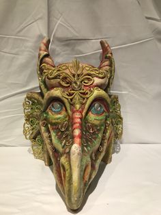 "Dragon Mask Size: one size Traditional and original papier-mache Venetian mask, handmade and decorated with acrylic colors and lace insert. This traditional Venetian mask shape is called \"Dragon mask\" and is a full face mask. All our masks are handmade papier-machè masks, made in Venice. Our decorators use techniques typical of the Venetian tradition such as stucco, acrylics, gold and silver-leaf, macramè, passementerie, pearls and crequelè to give you a wide range of masks. The mask could be Handmade Fantasy Masks And Prosthetics For Costume, Fantasy Festival Eye Mask, Fantasy Eye Mask For Festivals, Fantasy Masks And Prosthetics For Fantasy Events, Fantasy Style Festival Eye Mask, Fantasy Masks For Carnival Events, Handmade Fantasy Masks And Prosthetics For Costume Party, Fantasy Masks And Prosthetics For Carnival Festival, Fantasy Masks And Prosthetics For Events