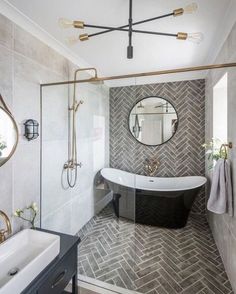 a bathroom with a bathtub, mirror and sink in the corner on the wall