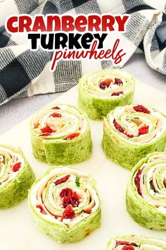 cranberry turkey pinwheels on a cutting board with the title text overlay