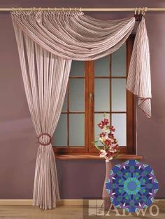 a vase with flowers sitting in front of a window covered by curtains and drapes