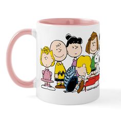 a pink and white coffee mug with a cartoon family on it