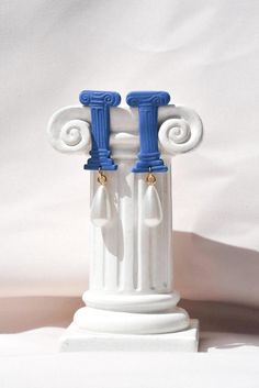 Unique earrings inspired by the architectural beauty of Ancient Greece. Bold and statement earrings for history and art lovers.  Size 2.6 x 4.4 x 0.10 cm + the renaissance pearl  If you are into a more minimal look, please check our white column earrings: https://treasurehuntstudioco.etsy.com/listing/1208279701/greek-column-clay-earrings-ancient ▫️ DETAILS ▫️ -Lightweight polymer clay. -Renaissance pearl.  -All posts & backings are gold plated or surgical stainless steel which makes each earring Greek Vases For Kids Clay, Roman Earrings, Roman Clay, Blue Pearl Earrings, Greek Columns, Greek Blue, Greek Gifts, Blue Pearl, Travel Jewelry