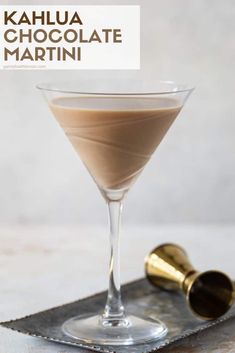 a chocolate martini in a glass on a tray