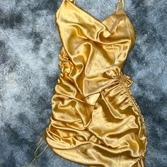 Gold Satin Spaghetti Strap Dress Size Small. Adjustable Length From Ankle Length To Mini Dress With Scrunchy Sides. Never Worn Ruched Cami Mini Dress For Party, Gold Sleeveless Ruched Mini Dress, Gold Satin Mini Dress For Summer, Party Cami Dress With Ruched Details, Gold Spaghetti Strap Dress For Summer, Gold Spaghetti Strap Summer Dress, Gold Mini Dress With Spaghetti Straps For Summer, Gold Spring Dress With Spaghetti Straps, Gold Spaghetti Strap Mini Dress For Date Night