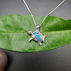 Visit our online shop at: Etsy.com/shop/925ForHer *sterling silver necklace pendant / sea turtle *small pendant with the option to buy a silver box chain necklace 16, 18, or 20 inches *southwestern jewelry *blue opal / lab created / inlaid opal *calibrated pre-cut stones: inlaid blue opal *back of jewelry items are all covered / do not show the back of stones *all jewelry items are made to ship, slight variations in stones will occur compared to pictures. *size of a penny is 19mm or a dime is 18mm in diameter for comparing the size with jewelry items. *free small convenient gift box *free shipping in the US, shipping from the US without insurance. *most orders will be shipped same day or within 24 hours from the time of placing orders during USPS working hours. *seller provides one-time FR Silver Turtle Necklace For Gift, Turtle Shaped Sterling Silver Jewelry Gift, Sterling Silver Turtle Jewelry Gift, Sterling Silver Turtle Necklace For Gifts, Sterling Silver Turtle Necklace For Gift, Handmade Sterling Silver Turtle Jewelry, Handmade Turtle-shaped Sterling Silver Jewelry, Colorful Sea Turtle, Sea Turtle Necklace