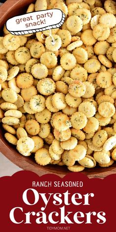 a bowl filled with baked oyster crackers next to a sign that says great party snack