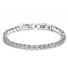 Gorgeous Silver Cubic Zirconia Tennis Bracelet with the Highest Grade of Cubic Zirconia Diamonds that sparkle!  Make a statement with our luxurious tennis bracelet! Featuring a fold-over clasp, this stunning piece is the epitome of style and elegance. Crafted with attention to detail, the high-quality silver plating and sleek design make it the perfect accessory to complement any outfit. Whether you're dressing up for a special occasion or adding a touch of glamour to your everyday look, this br Cz Bracelet, Titanium Bracelet, Adjustable Jewelry, Wedding Jewelry Bracelets, Hip Hop Jewelry, Tennis Bracelet Diamond, Mua Sắm, Bangles Jewelry, Steel Jewelry