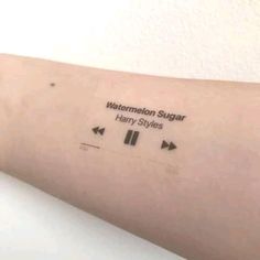 a person with a tattoo on their arm that says, watermelon sugar harry styles